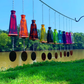 Glass Wind Chimes Made From Pyramid Shaped Bottles: Amber